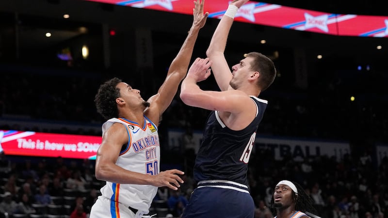 Denver Nuggets center Nikola Jokic (15) shoots over Oklahoma City Thunder forward Jeremiah...