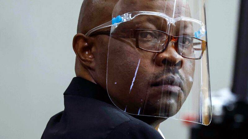 FILE - Accused serial killer Billy Chemirmir looks back during his retrial on April 25, 2022,...