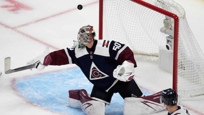 The puck sails past Colorado Avalanche goaltender Ivan Prosvetov and hits the frame of the net...