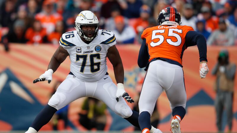 Los Angeles Chargers offensive tackle Russell Okung blocks as Denver Broncos outside...